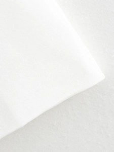 Close-up of premium white textile fabric texture for summer sleeveless vest suit