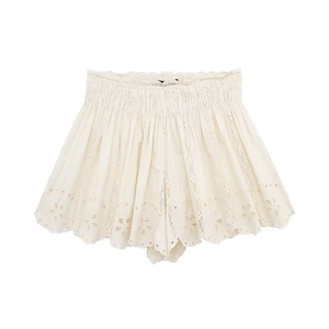 Detail of cream white lace shorts featuring floral embroidery and elastic pleated waist