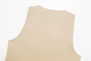 Detailed close-up of beige linen sleeveless top showing premium woven fabric texture
