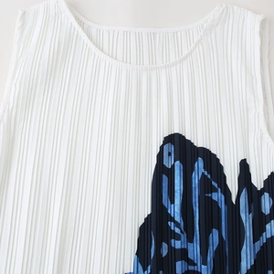 Sleeveless pleated white dress featuring blue artistic floral print and round neckline