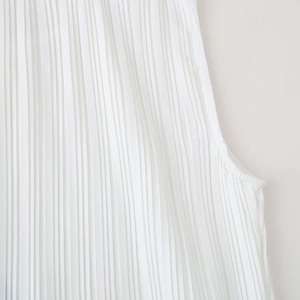 White pleated summer dress with high-quality vertical pleat texture and soft sheen