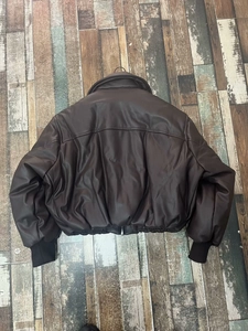 Oversized dark brown padded faux leather jacket with rib-knit cuffs and hem detail