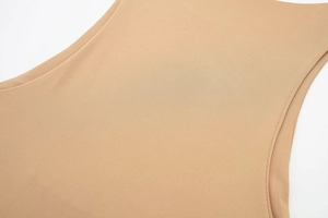 Detailed close-up of high-elasticity nude knit fabric with premium double stitching