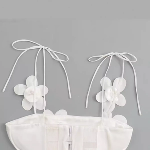 White camisole top for women with 3D floral accents and adjustable bow straps