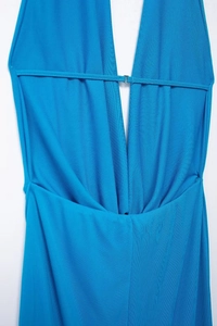 Detail of royal blue halter dress with deep V-neckline and horizontal buckle strap