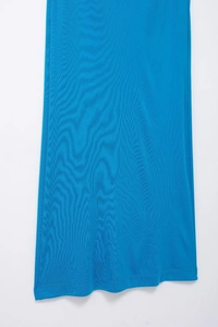 Detailed close-up of lake blue pleated knitted dress fabric showing texture and hem