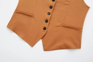 Close-up of caramel linen blend vest showing five buttons and welt pocket details