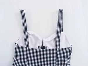Detailed view of black and white gingham corset top with thin straps and heart neckline