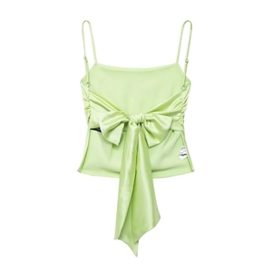Detailed view of large bow knot on light green satin camisole top with silk texture