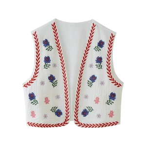 Women's white sleeveless open vest with floral embroidery and bohemian ethnic trim
