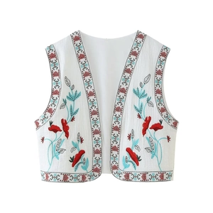 Women's white boho embroidered vest with floral patterns and geometric trim design