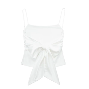 Detailed view of white satin camisole featuring a large decorative front bow