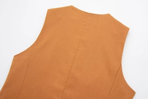 Detail view of linen blend vest showing back seam stitching and fabric texture