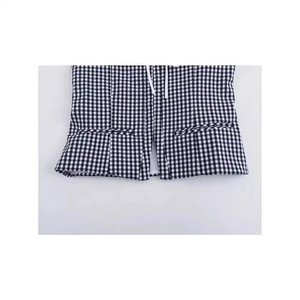 Close-up of black and white gingham corset top featuring decorative pockets and drawstrings