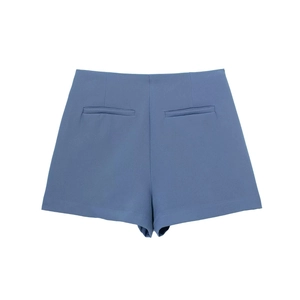 Rear view detail of high-waist asymmetric shorts with neat welt pockets in misty blue