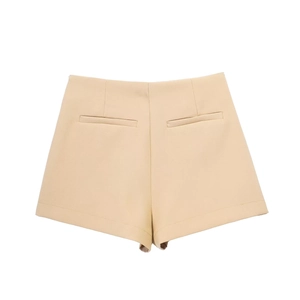 Detail view of khaki high-waisted shorts with decorative back welt pockets and crisp seams