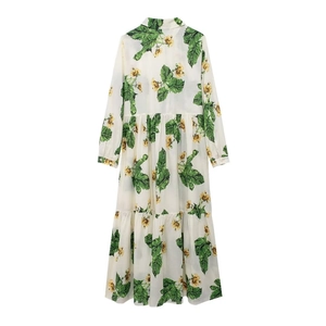 Floral print long sleeve tiered shirt dress with green tropical leaf and yellow flower patterns