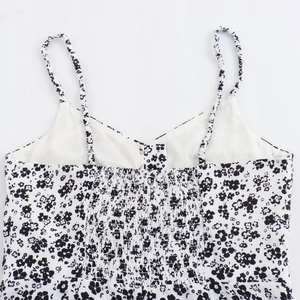 Summer floral print dress with thin shoulder straps and shirred back detail on white fabric