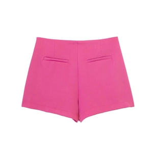 Rear view of rose pink high waisted shorts featuring clean darts and symmetric welt pockets