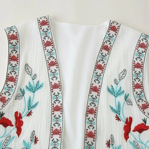 Women's white sleeveless vest with vintage ethnic embroidery and natural textured fabric