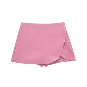 Detail view of pink high-waisted asymmetric skort with a clean wrap-front design