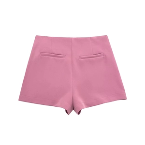 Back view of high-waist pink tailored shorts with symmetrical welt pocket details