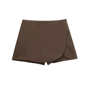 Detail view of chocolate wrap skort featuring asymmetrical hem and side zipper closure