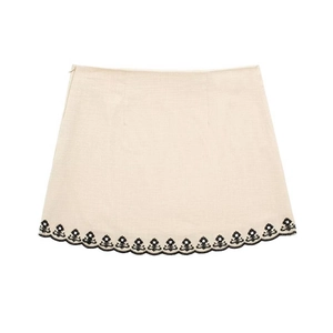 Women's cream mini skirt with black floral embroidery and side zipper flat lay