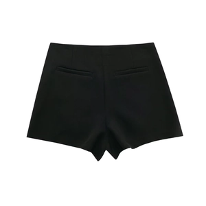 Rear view of black asymmetric shorts featuring tailored welt pockets and a smooth waistline