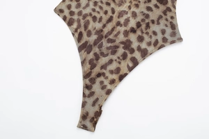 Close-up detail of leopard print mesh fabric and seamless bottom cut on the bodysuit