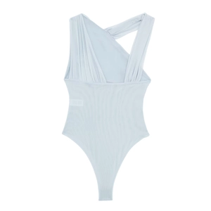 Detail showing the light blue bodysuit with asymmetric pleated mesh and thin straps