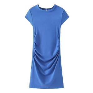 Close-up of side drawstring ruching on a navy blue ribbed knit bodycon dress