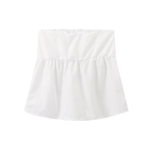Detail view of the white elastic waist layered shirt extender with a pleated flared hemline