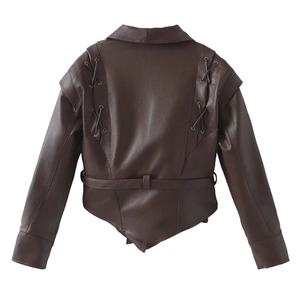 Detail of dark brown faux leather jacket back with black lace-up straps and belted waist