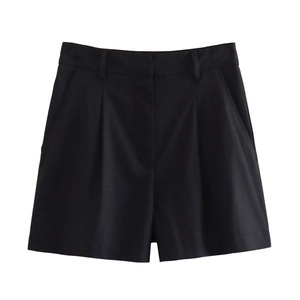 Detail of high-waisted black linen blend shorts with front pleats and side pockets