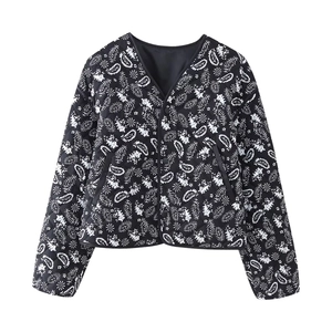 Women's black quilted jacket with white paisley print and minimalist V-neck design