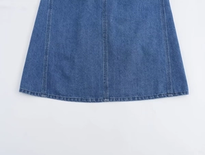 Detailed macro view of stitched denim seams on light blue A-line summer dress