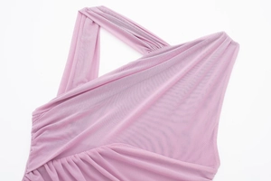 Close-up of asymmetrical draped tulle mesh fabric with ruched neck detail in mauve