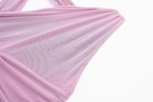 Detail view of the pink pleated mesh fabric showing breathable texture and soft layers