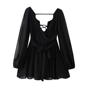 Detail of a black deep V-neck dress with adjustable waist tie and long lantern sleeves
