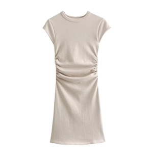 Chic women's crew neck slim knit mini dress with stylish side ruching in beige color