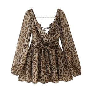 Detail view of leopard print mini dress with deep V-neckline and waist tie decoration