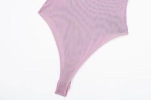 Close-up of lavender mesh bodysuit showing sheer fabric and snap button closure at bottom