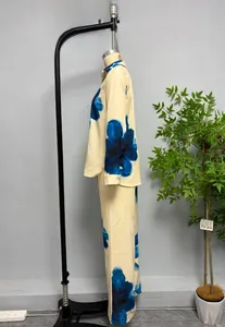 Detail of printed long-sleeve shirt and wide-leg pants set with blue floral patterns