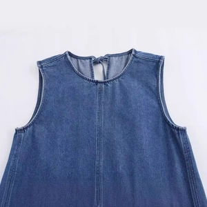 Light blue denim sleeveless dress with round neck and back tie closure in a classic wash