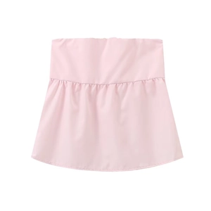 Detail of light pink layered shirt extender with elastic waist and ruffled hemline