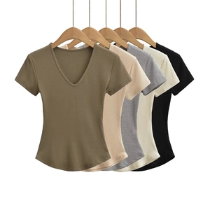 Detail view of V-neck ribbed slim fit T-shirts in five colors on wooden hangers
