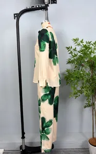 Detail of floral printed long-sleeve shirt and straight trousers with fluid drape fabric