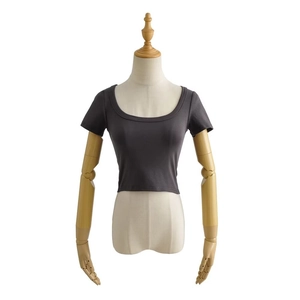 Detailed view of dark grey slim fit cropped t-shirt with scoop neckline on mannequin