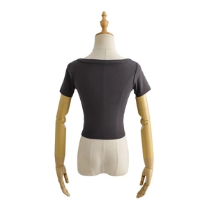 Close-up back view of dark grey knitted crop top with slim fit and round neckline